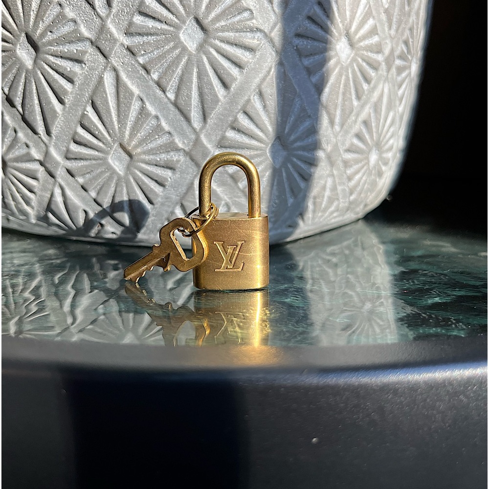 Authentic Louis Vuitton Gold lock and key number 320